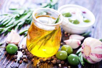 green olives and olive oil in bottle