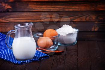 milk products and fresh eggs on a table