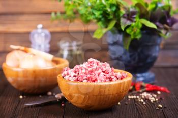 minced meat in bowl and on a table