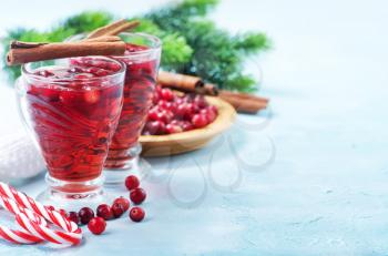 cranberry drink and berries, christmas drink in glass and on a table