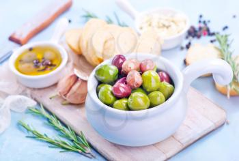 olives and fresh bread on a table