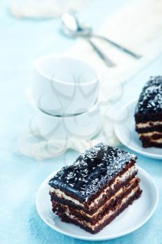 chocolate cake on plate and on a table