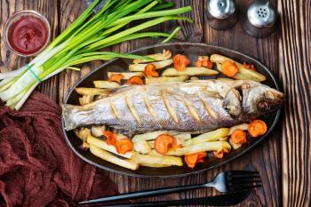 baked fish with vegetable on a table