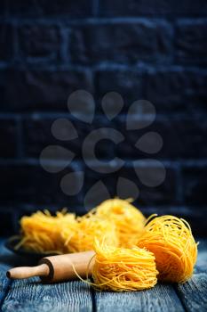 raw noodles from chicken yolks on a table