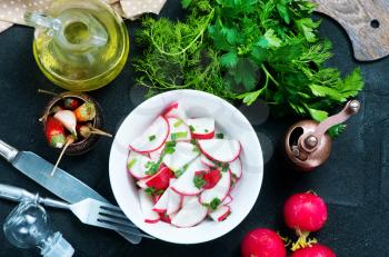 radish salad in bowl and on a table