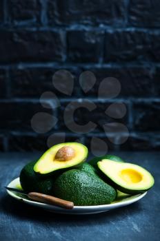 fresh avocado on a table, green avocado