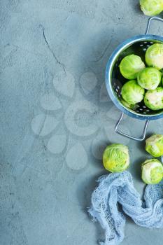 raw brussel sprouts on a table, fresh brussel sprouts