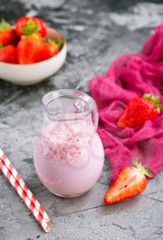 strawberry drink with milk in the jug