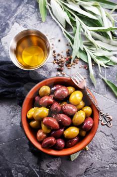 olives in bowl and on a table