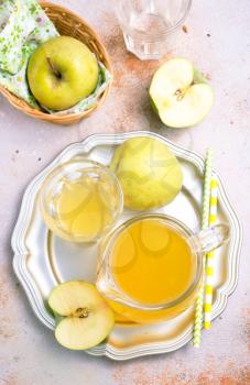 apple juice in glass on a table