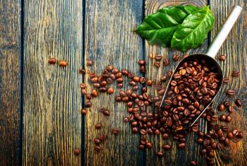 coffee beans on a table, aromatic coffee beans, coffee background