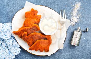 fish nuggets with sauce, fast food on a table