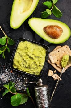 avocado sauce with lime in bowl, sauce in bowl