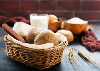 fresh wheat bread in basket and on a table