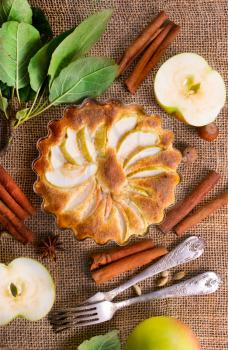 apple pie with cinnamon on a table