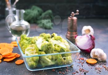 raw broccoli and raw carrot on a table