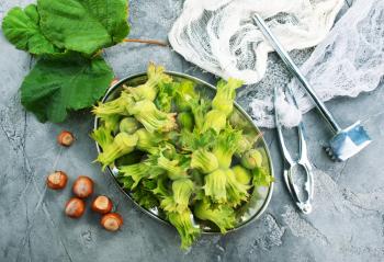 fresh hazelnuts on a table, stock photo