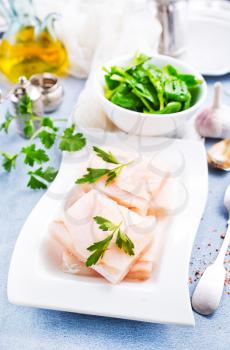 raw fish fillet with salt and spice, white fish