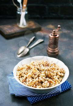 boiled quinoa in white bowl, stock photo