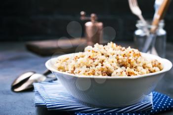 boiled quinoa in white bowl, stock photo