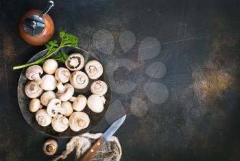 raw mushrooms, raw champignons, champignons on a table, stock photo