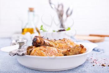 baked chicken legs with spica and fresh salad