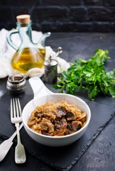 fried cabbage with mushrooms in white bowl