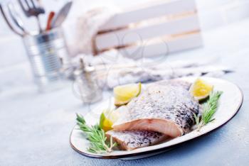 Fresh fish, raw cod fillets with rosemary and salt