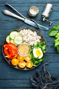 fresh ingredients for salad: bulgur and vegetables