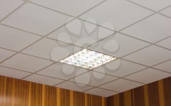 White office ceiling with built-in fluorescent lamp
