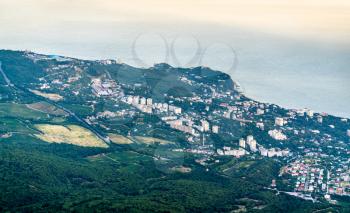 View of Yalta city from Ai-Petri mountain at sunset. Crimea