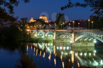 The San Esteban Convent and the Enrique Estevan bridge in Salamanca - Castile and Leon, Spain