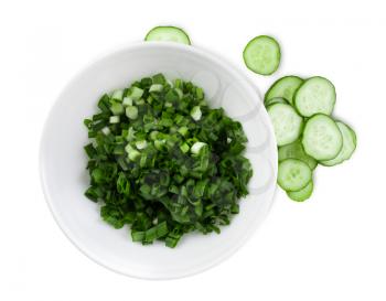 Cucumbers and green onions sliced for salad. White background. Clipping path.