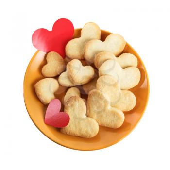 Cookies-hearts and valentines in a plate on a white background. Isolated with clipping path. Top view.