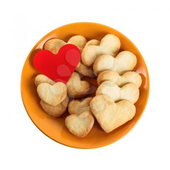Cookies-hearts on a plate on a white background. Isolated with clipping path. Top view.