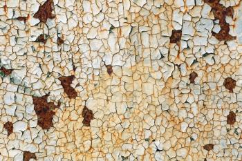 Grunge background with old peeling paint. Texture of rusty metal with cracked paint.