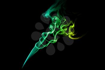 Abstract green and blue smoke on a dark background.