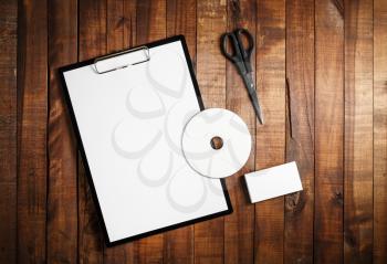 Photo of blank stationery set on wooden table background. ID template. Mock up for branding identity for designers. Mock-up for ID. For design portfolios. Top view.