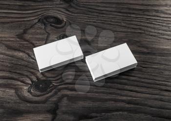 Photo of blank business cards on wood table background. Template for ID.
