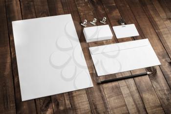 Blank corporate stationery set on wood table background. Branding mock up.