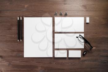 Branding mock up. Photo of blank corporate stationery set on wood table background. Flat lay.