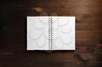 Blank notepad on wood table background. Template for branding identity. Flat lay.