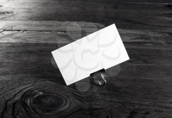 Blank white business card on wood background. Template for ID with plenty of copy space.