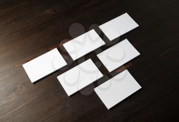 Photo of blank business cards on wood table background. Template for ID
