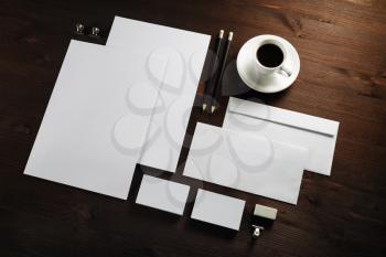 Photo of blank corporate stationery set on wooden background. Branding mock up.