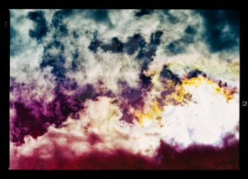 Horizontal vintage vivid vibrant cloudscape film scan design composition