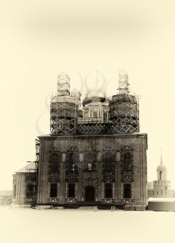 Vertical sepia vignette Russian orthodox church under construction background backdrop