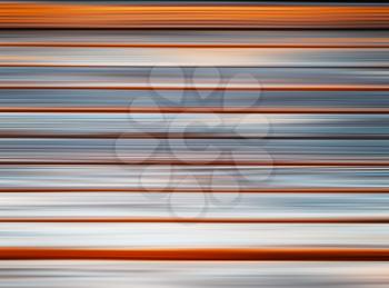 Horizontal orange and grey motion blur background