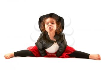 Little girl with black hat sitting and hamming