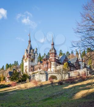 Peleș Castle near Sinaia and the Carpathian Mountains in a sunny day. Transylvania, Romania